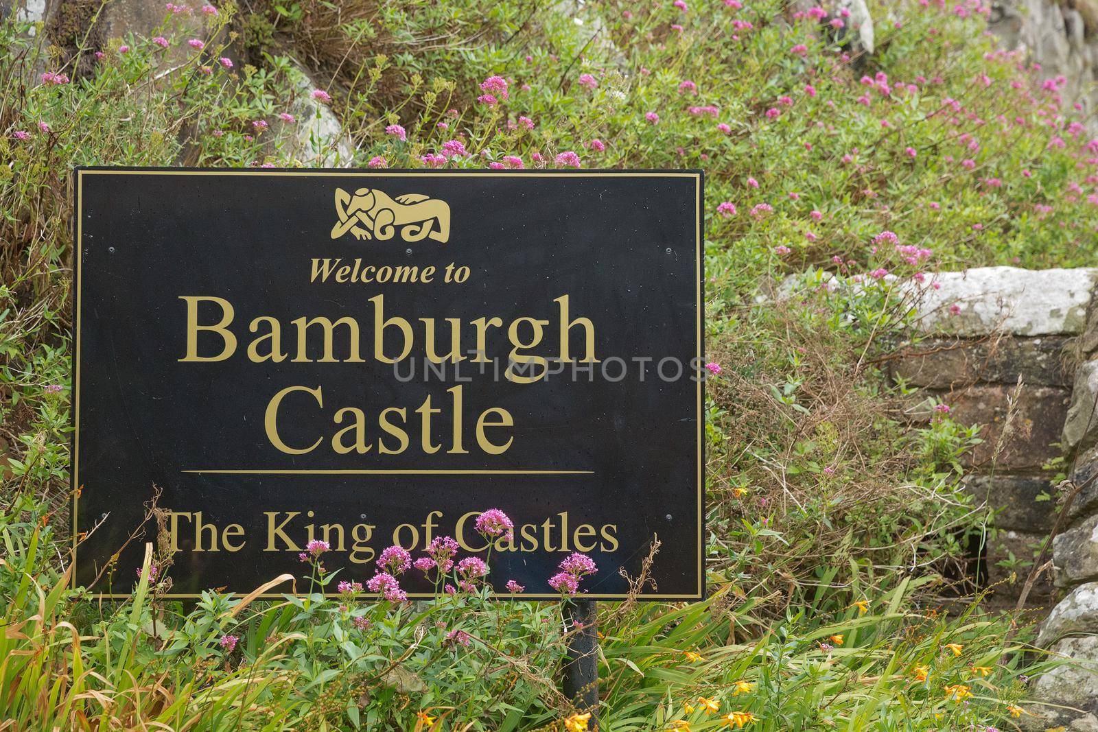 BAMBURGH, NORTHUMBERLAND, ENGLAND, UK - SEPTEMBER 10, 2017: Welcome sign of Bamburgh Castle in Northumberland, England, UK.