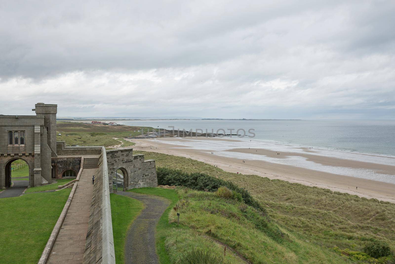 BAMBURGH, NORTHUMBERLAND, ENGLAND, UK - SEPTEMBER 10, 2017: View of a beach from Bamburgh Castle in Northumberland, England, UK.
