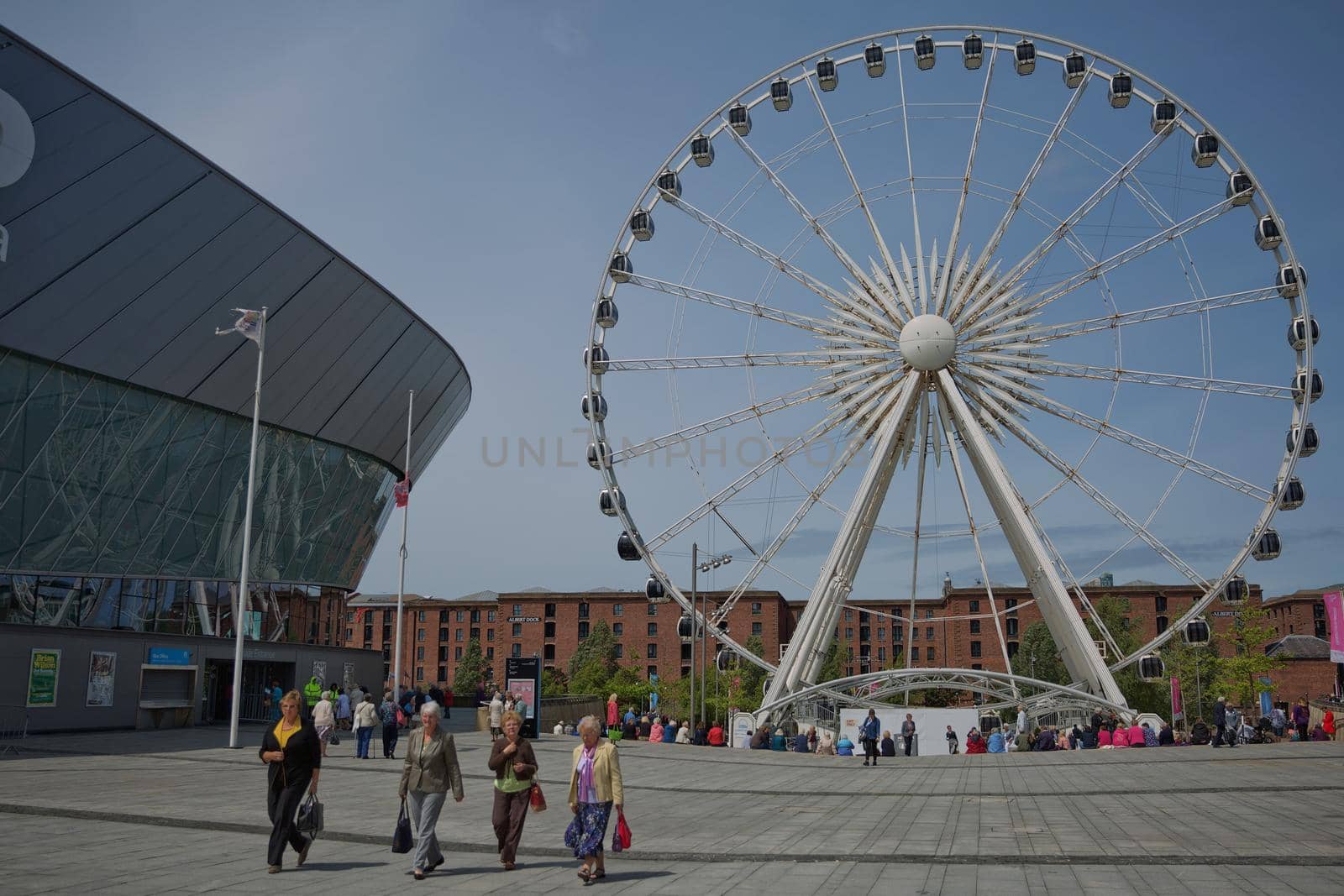 LIVERPOOL, ENGLAND, UK - JUNE 07, 2017: View of the ECHO convention center and an adjacent ferris wheel in Liverpool, England