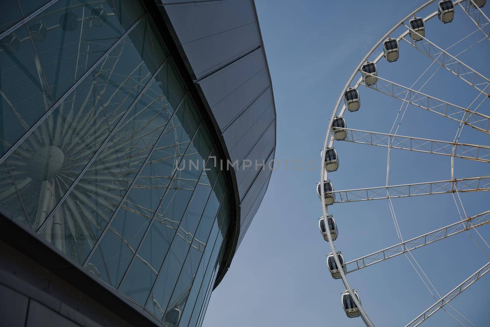 LIVERPOOL, ENGLAND, UK - JUNE 07, 2017: View of the ECHO convention center and an adjacent ferris wheel in Liverpool, England