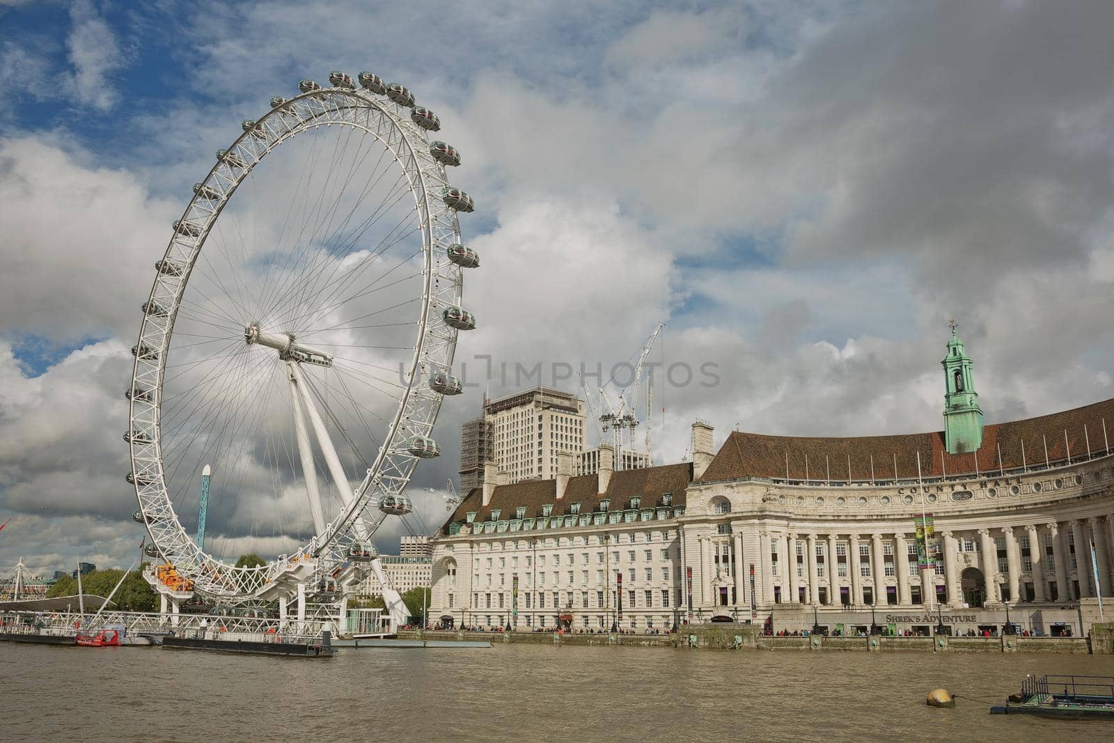 LONDON, UK - SEPTEMBER 08, 2017: View of the London Eye wheel and South Bank of the River Thames from Westminster bridge, London, UK