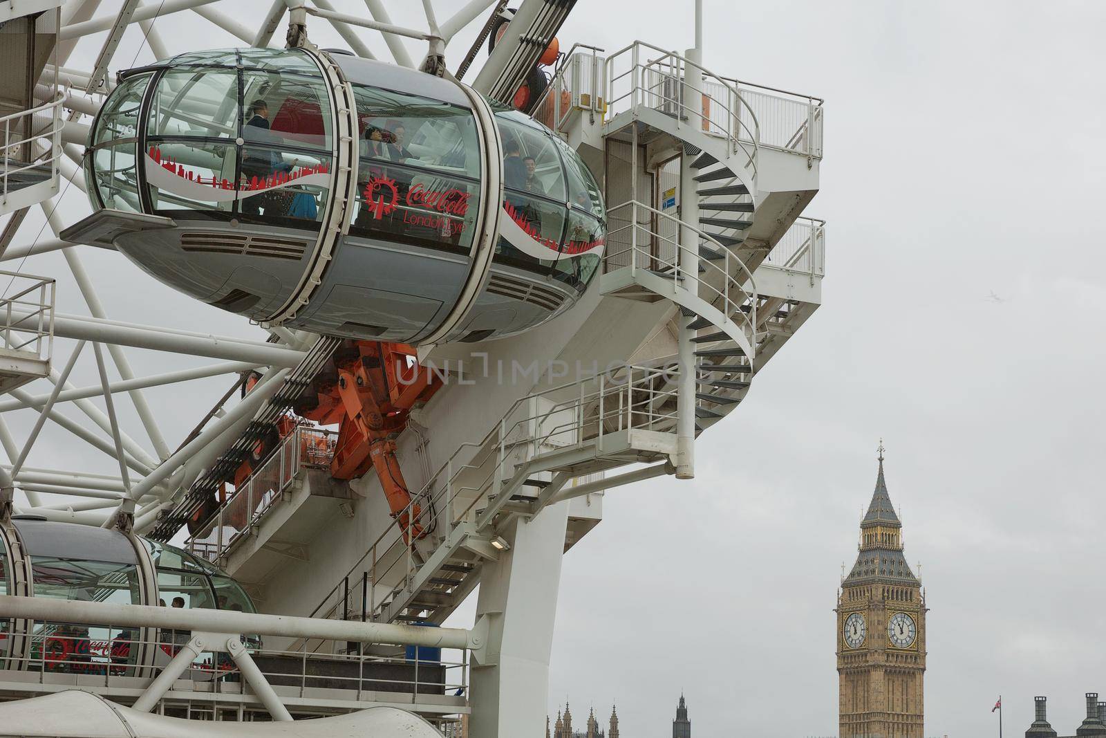 The London Eye ferris wheel on the South Bank of River Thames aka Millennium Wheel with Big Ben in the backround by wondry