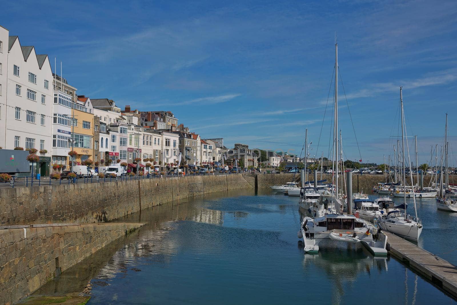 ST. PETER PORT, GUERNSEY, UK - AUGUST 16, 2017: Scenic view of a bay in St. Peter Port in Guernsey, Channel Islands, UK.