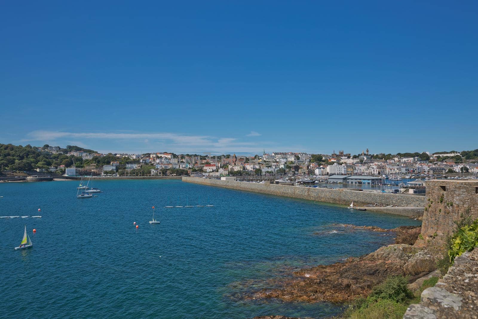 Scenic view of a bay in St. Peter Port in Guernsey, Channel Islands, UK by wondry