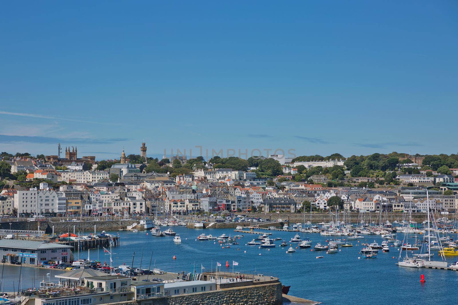 ST. PETER PORT, GUERNSEY, UK - AUGUST 16, 2017: Scenic view of a bay in St. Peter Port in Guernsey, Channel Islands, UK.