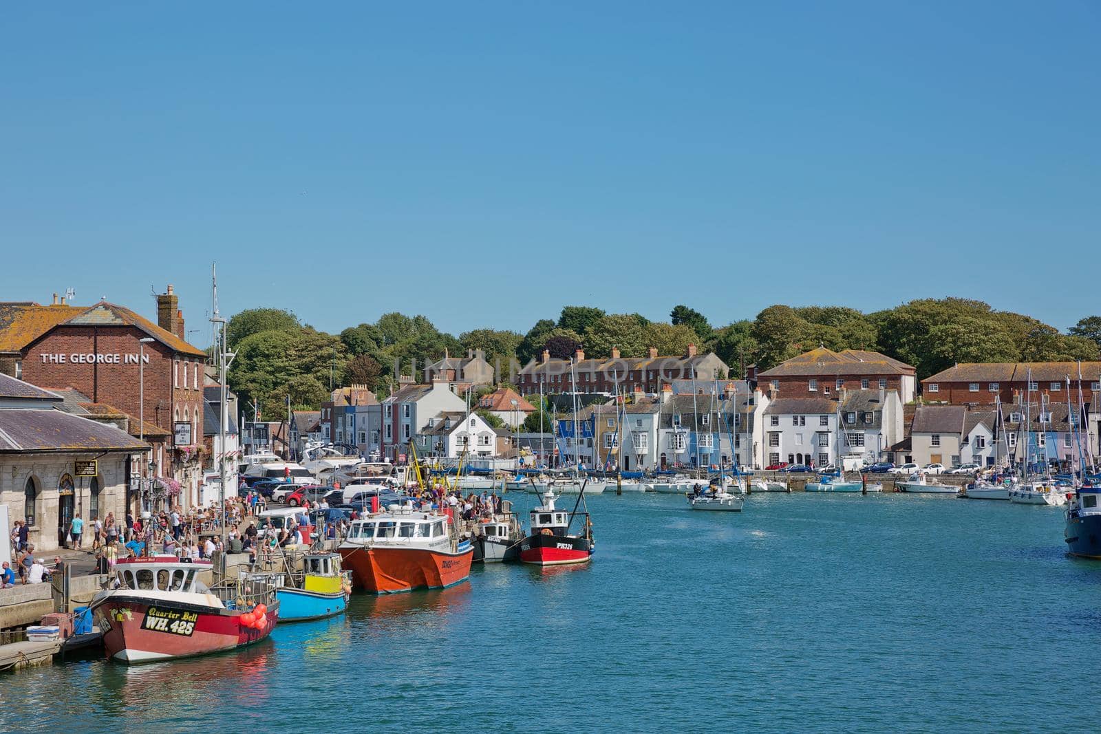 View of a port and bay in Weymouth in UK during beautiful sunny summer day by wondry