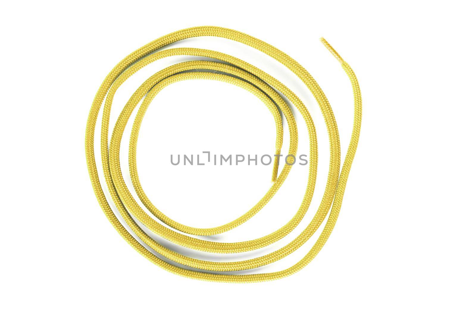 yellow shoe lace against white background