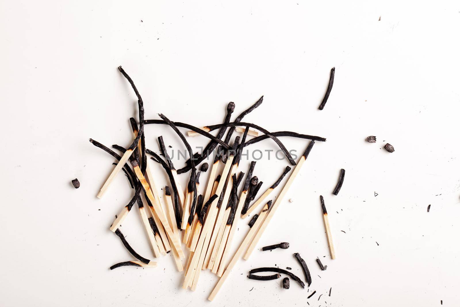 group of many burnt matchsticks thrown on a table