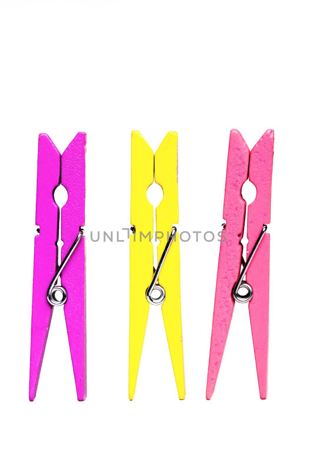 purple, yellow and pink clothes pegs by kokimk