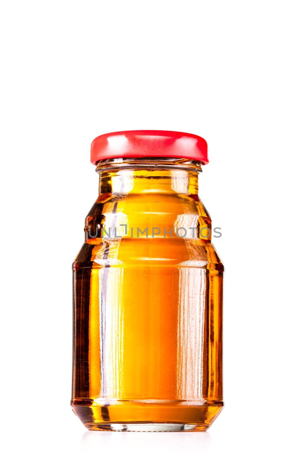 small glass bottle full with liquid isolated on white