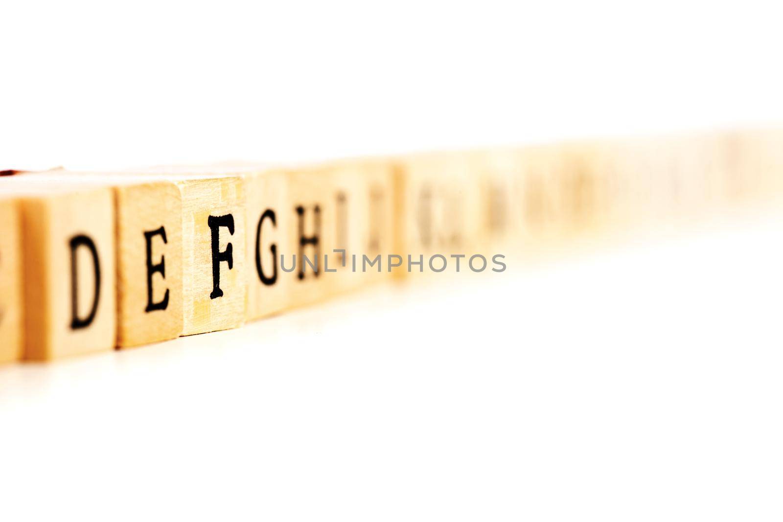 letters on wooden cubes, focus on f by kokimk