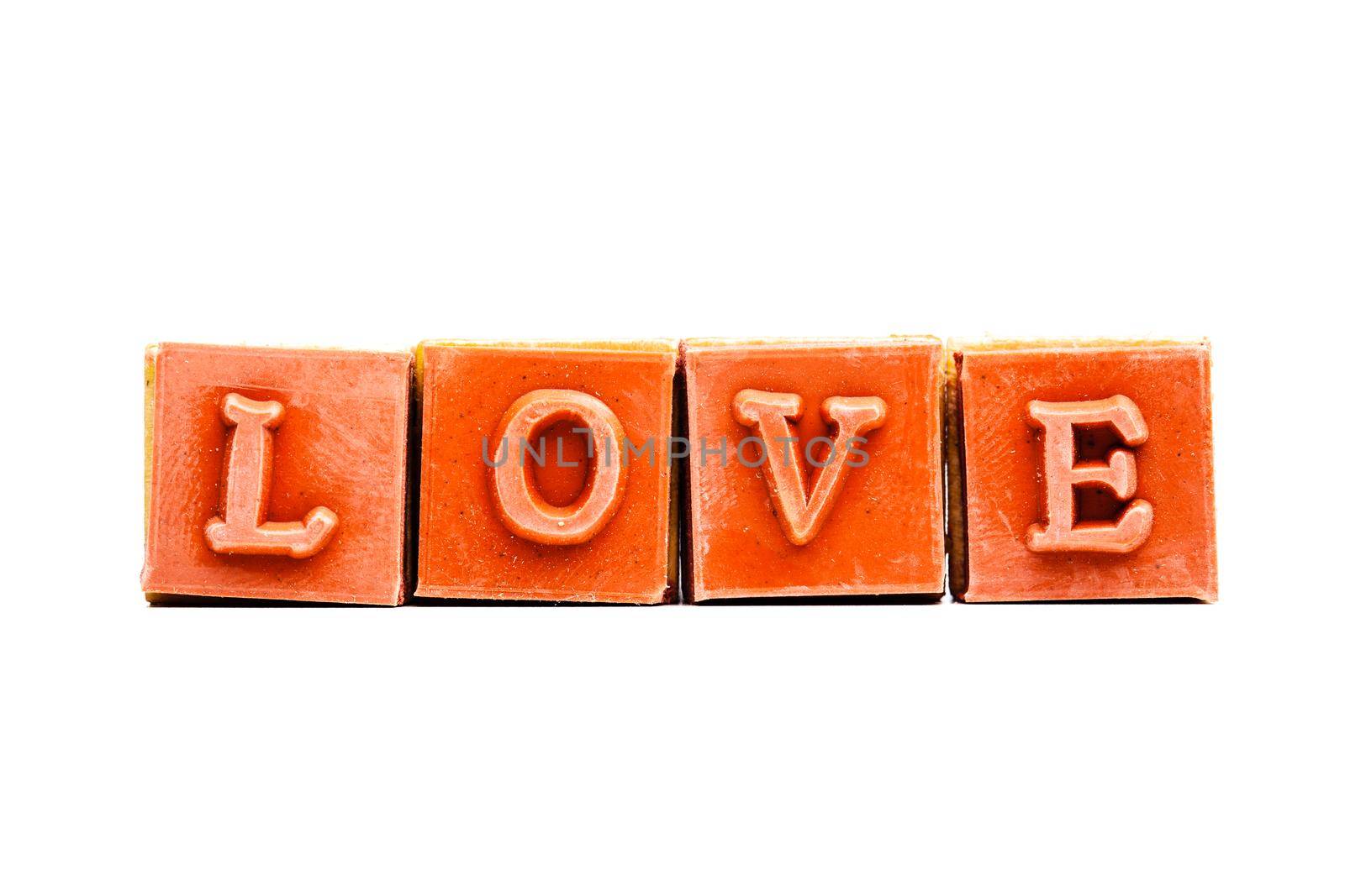 red rubber stamps forming the word love