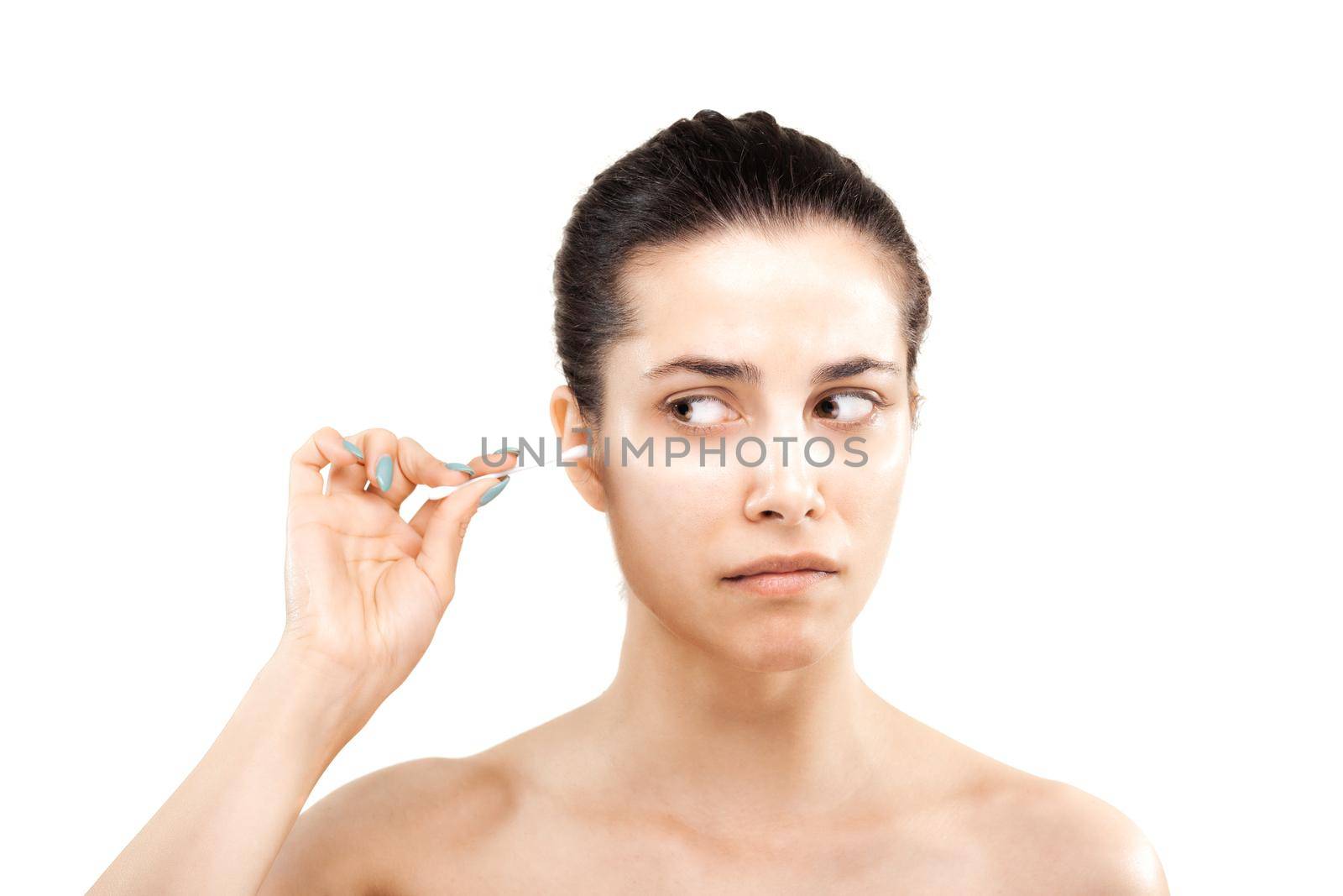 girl cleaning her ear with cotton stick and making grimace