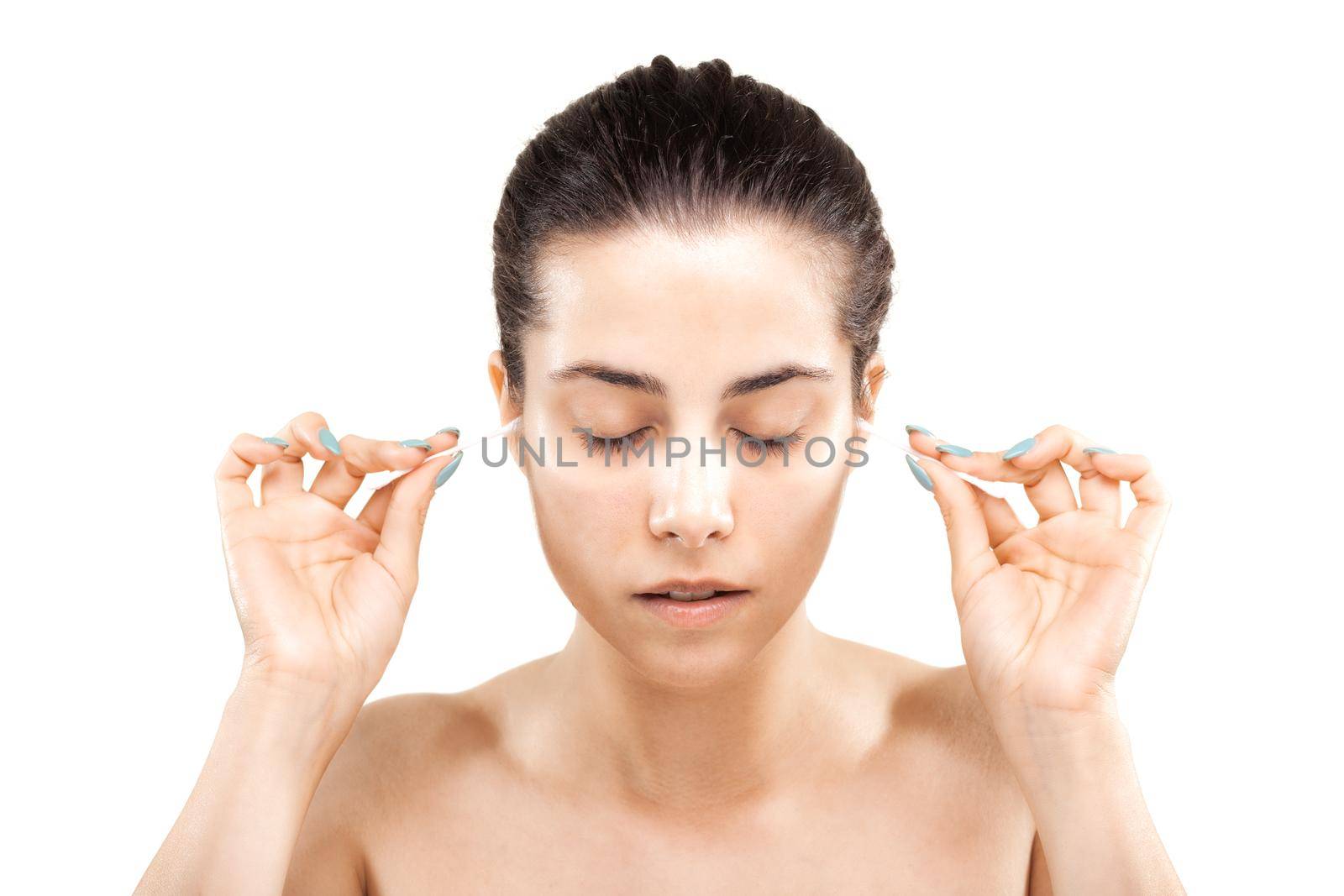 girl cleaning her ears with cotton sticks
