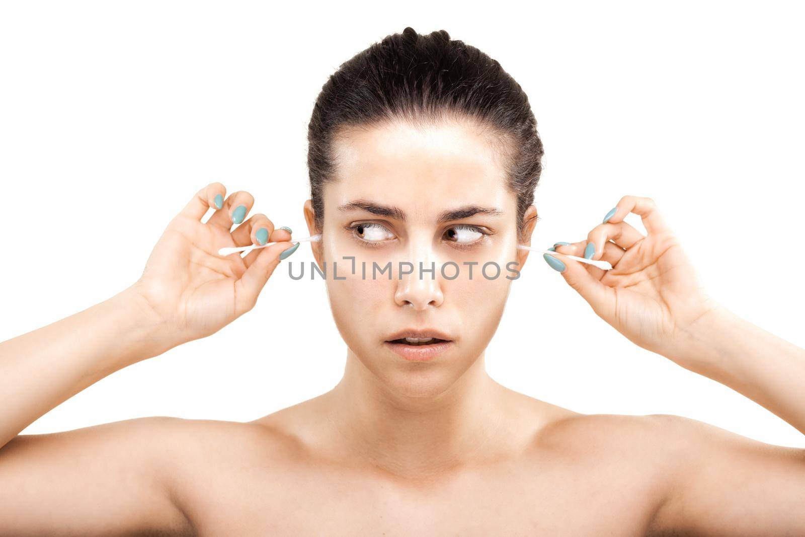 girl with cotton ear sticks making grimace by kokimk