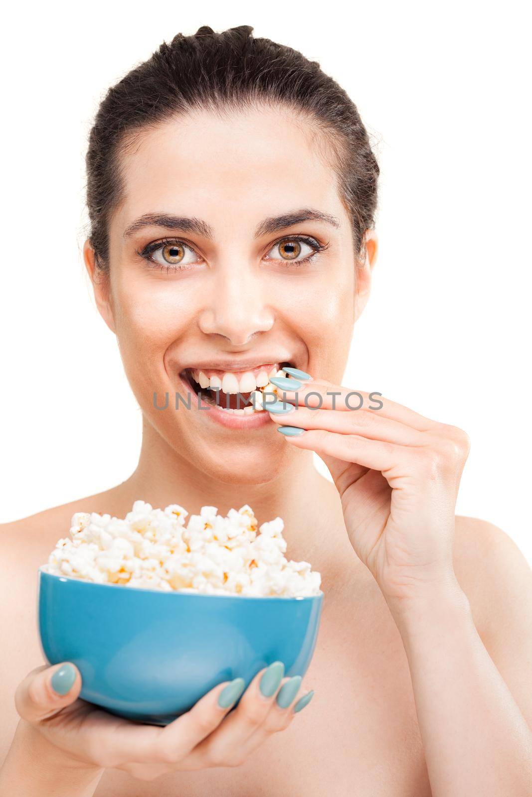 beautiful girl eating popcorn, happy satisfied expression