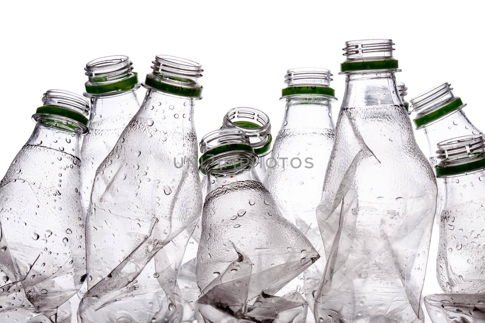 group of smashed empty plastic bottles, isolated on white background