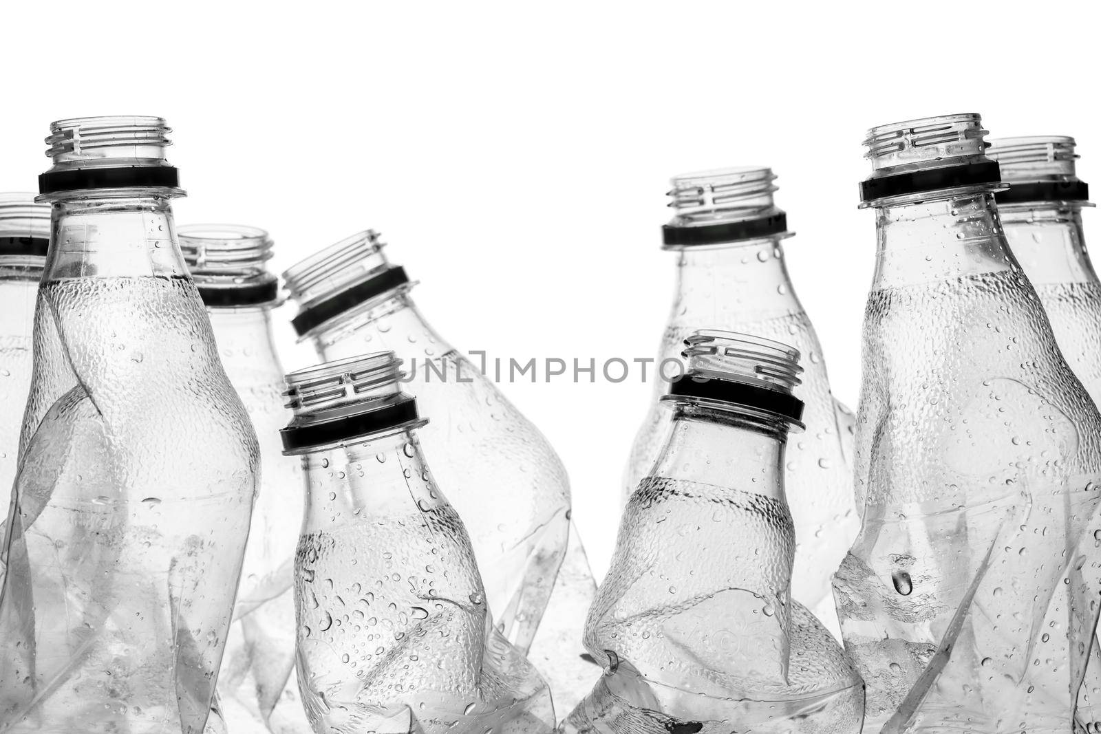 group of smashed empty plastic bottles, isolated on white background