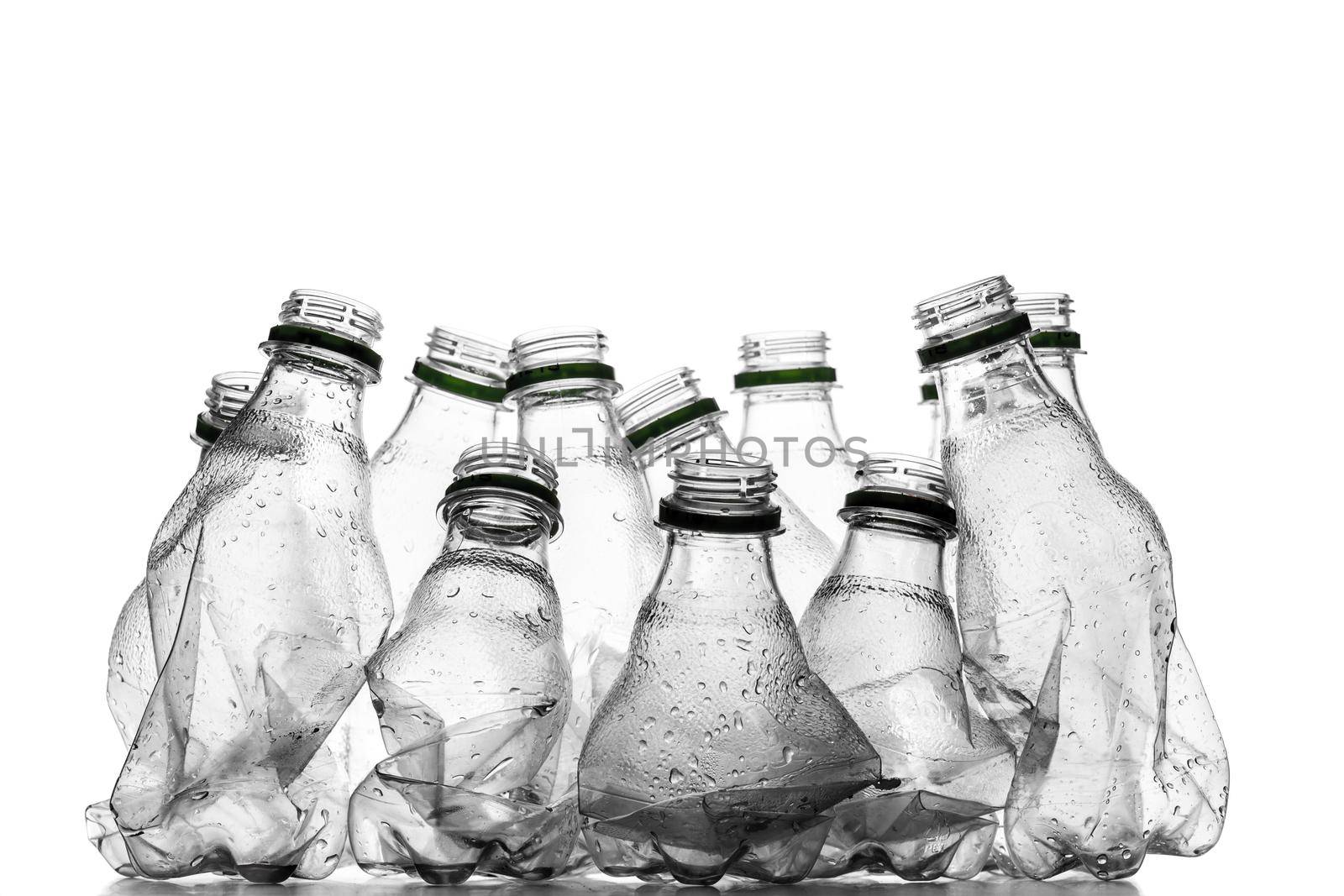 group of smashed empty plastic bottles, isolated on white background