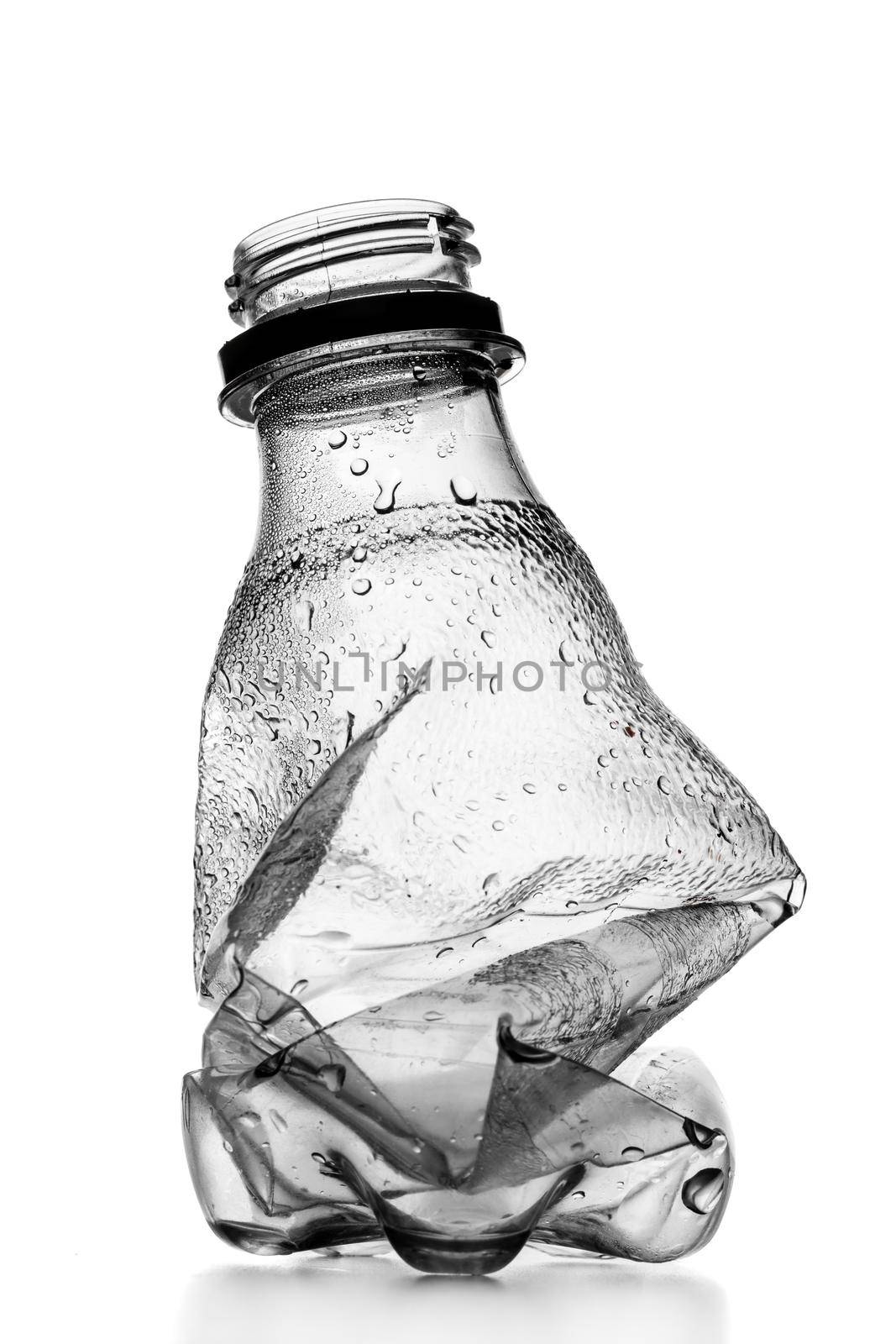 smashed empty plastic bottle, isolated on white background