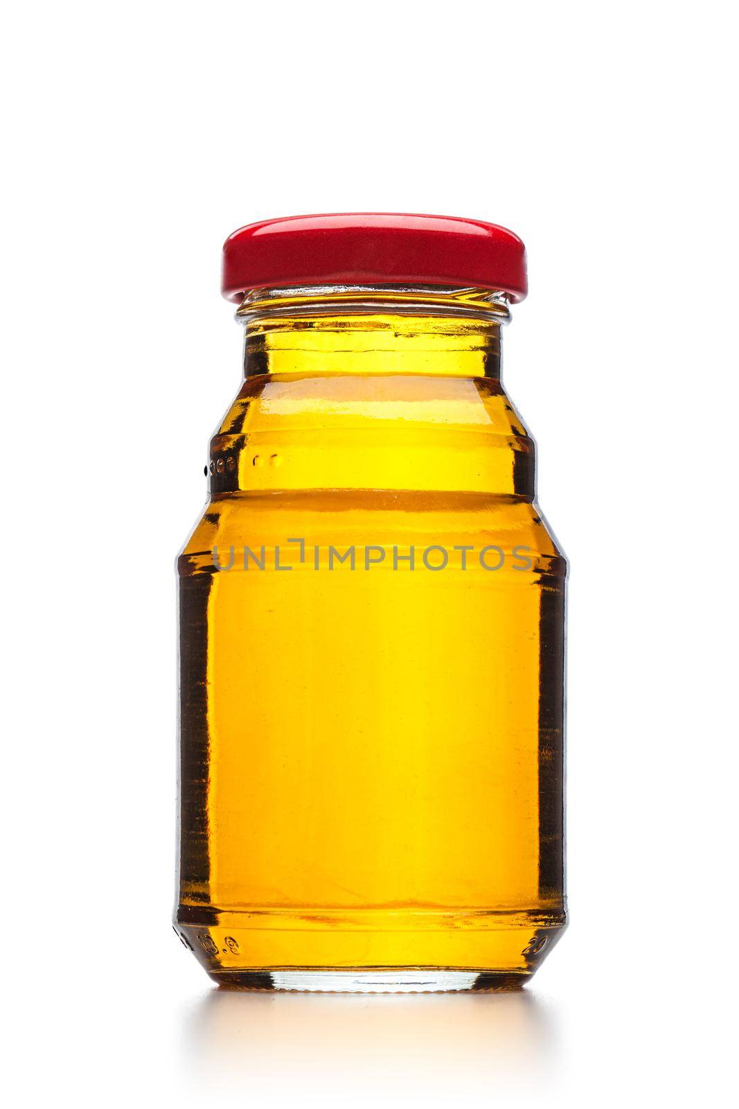 apple juice in a little glass bottle isolated on white background