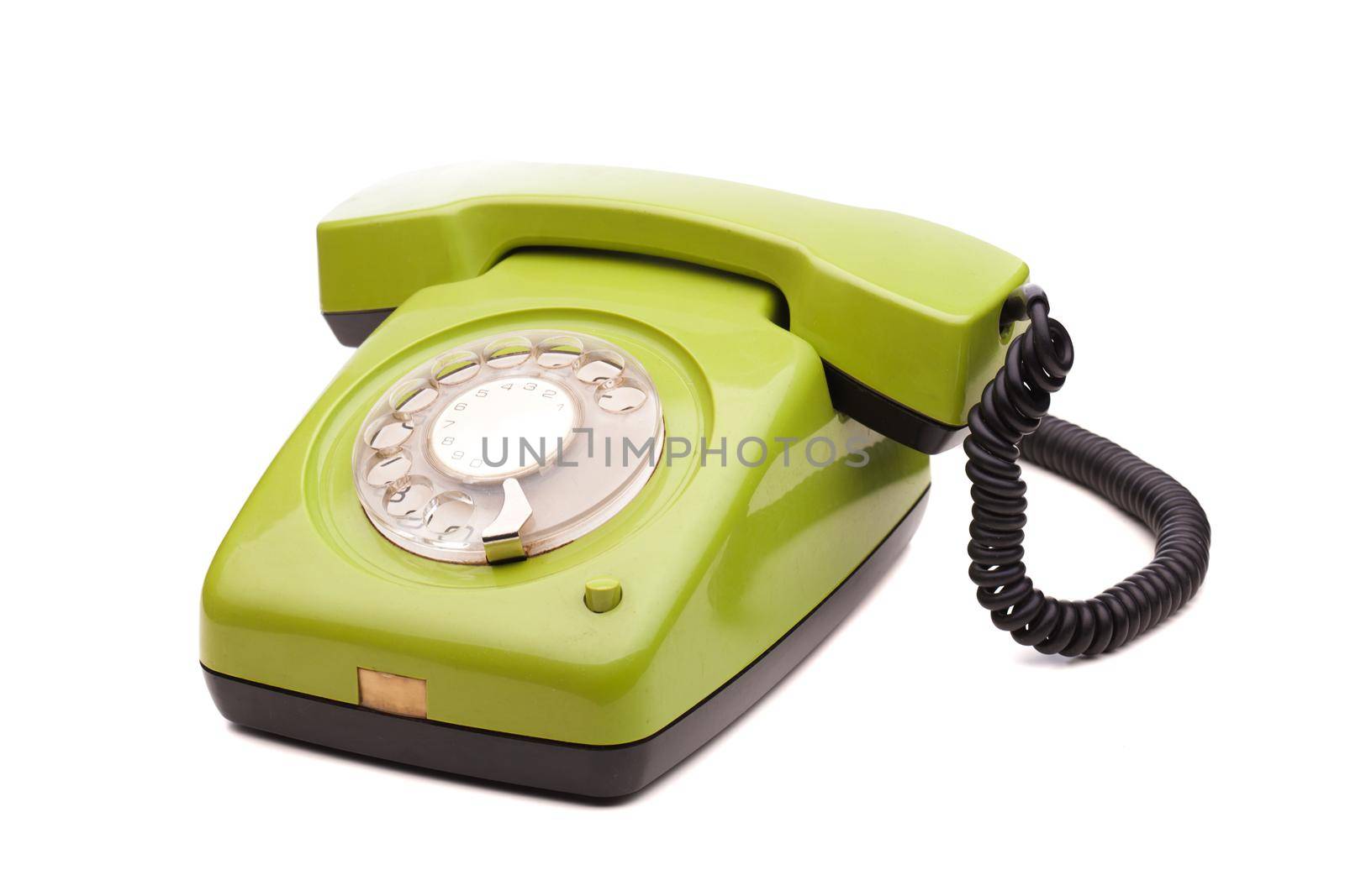 Green telephone retro style on white background. Vintage phone handset receiver.