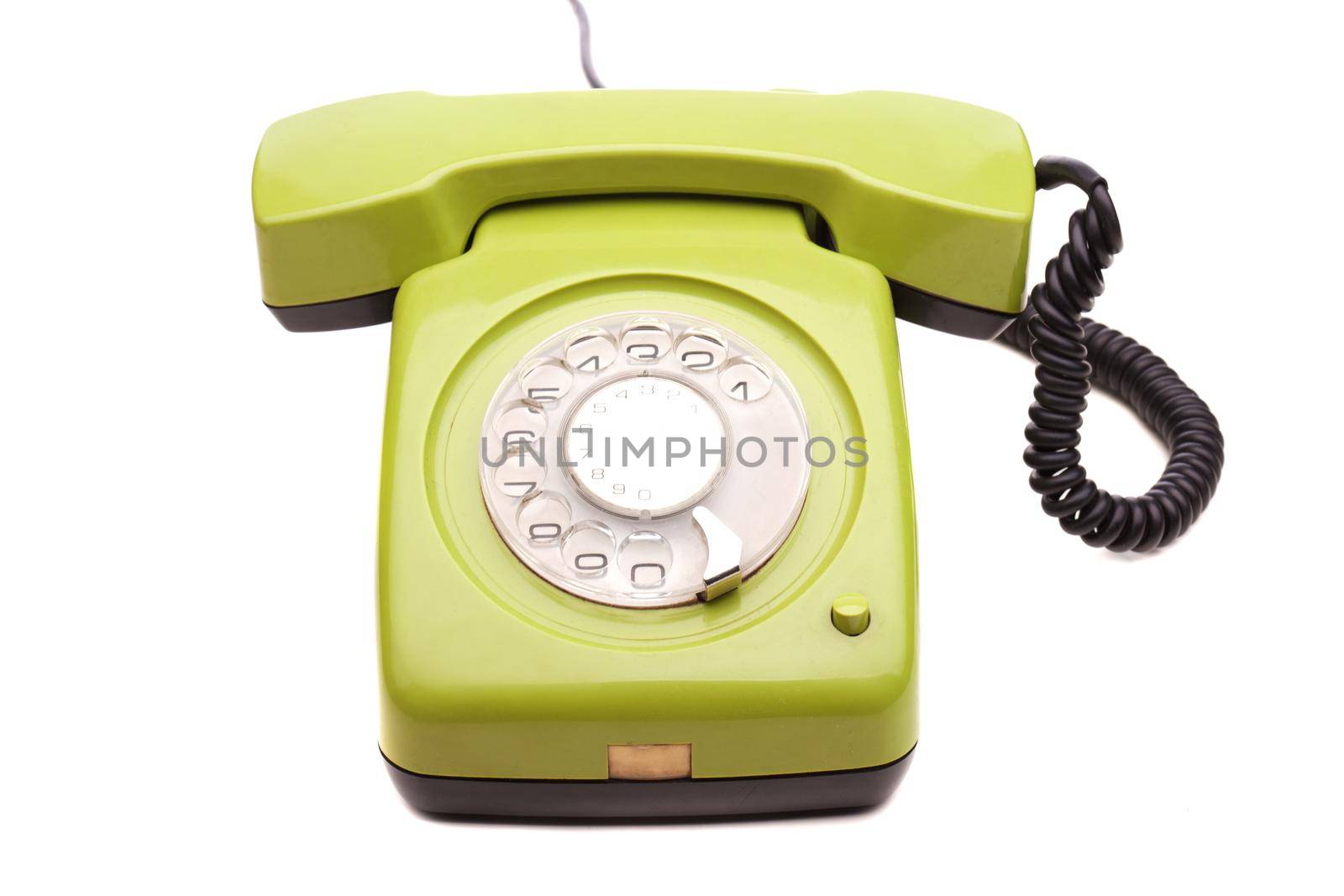 Green telephone retro style on white background. Vintage phone handset receiver.