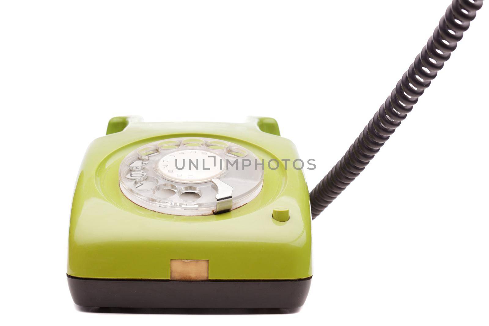 Green telephone retro style on white background. Vintage phone handset receiver.