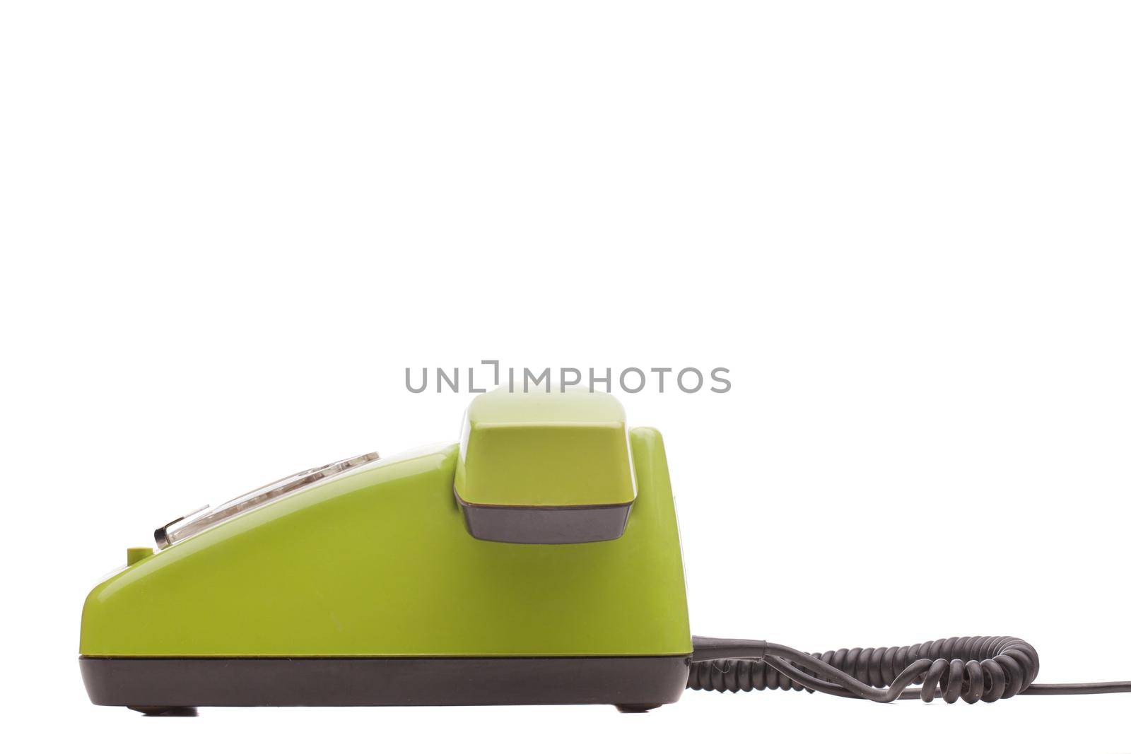 Green telephone retro style on white background. Vintage phone handset receiver.