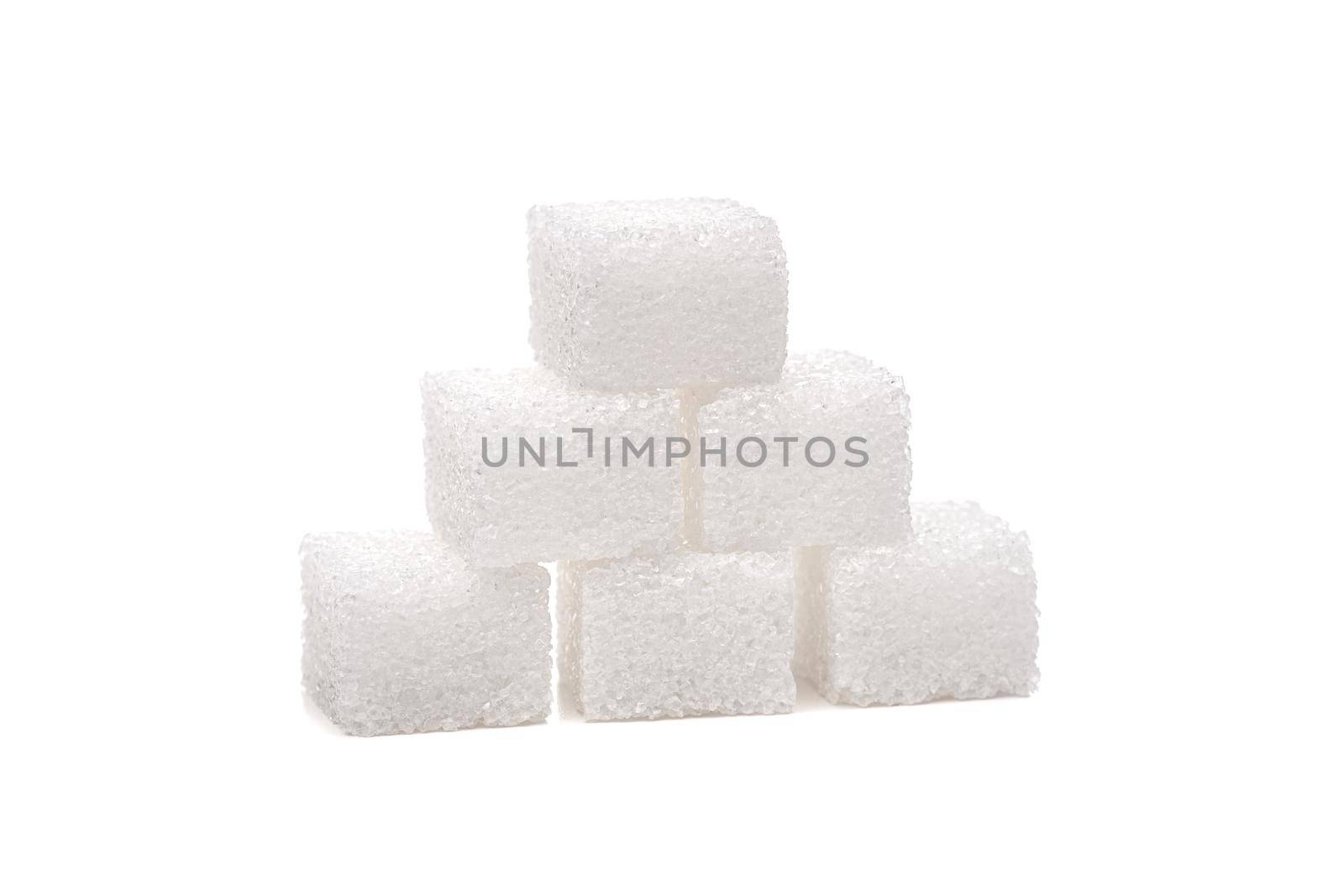 Sugar cubes on one another, isolated on white background. by kokimk