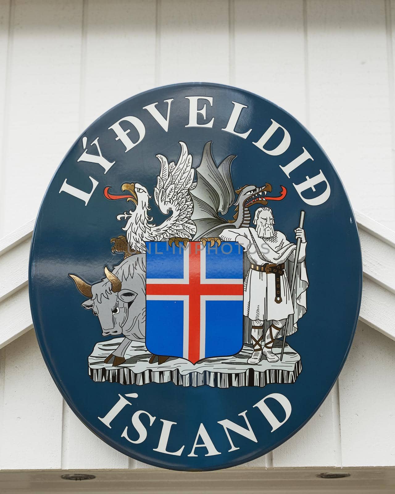 TORSHAWN, FAROE ISLANDS, DENMARK - AUGUST 21, 2018: Flag and welcome sign of Faroe Islands, Denmark on white wooden wall