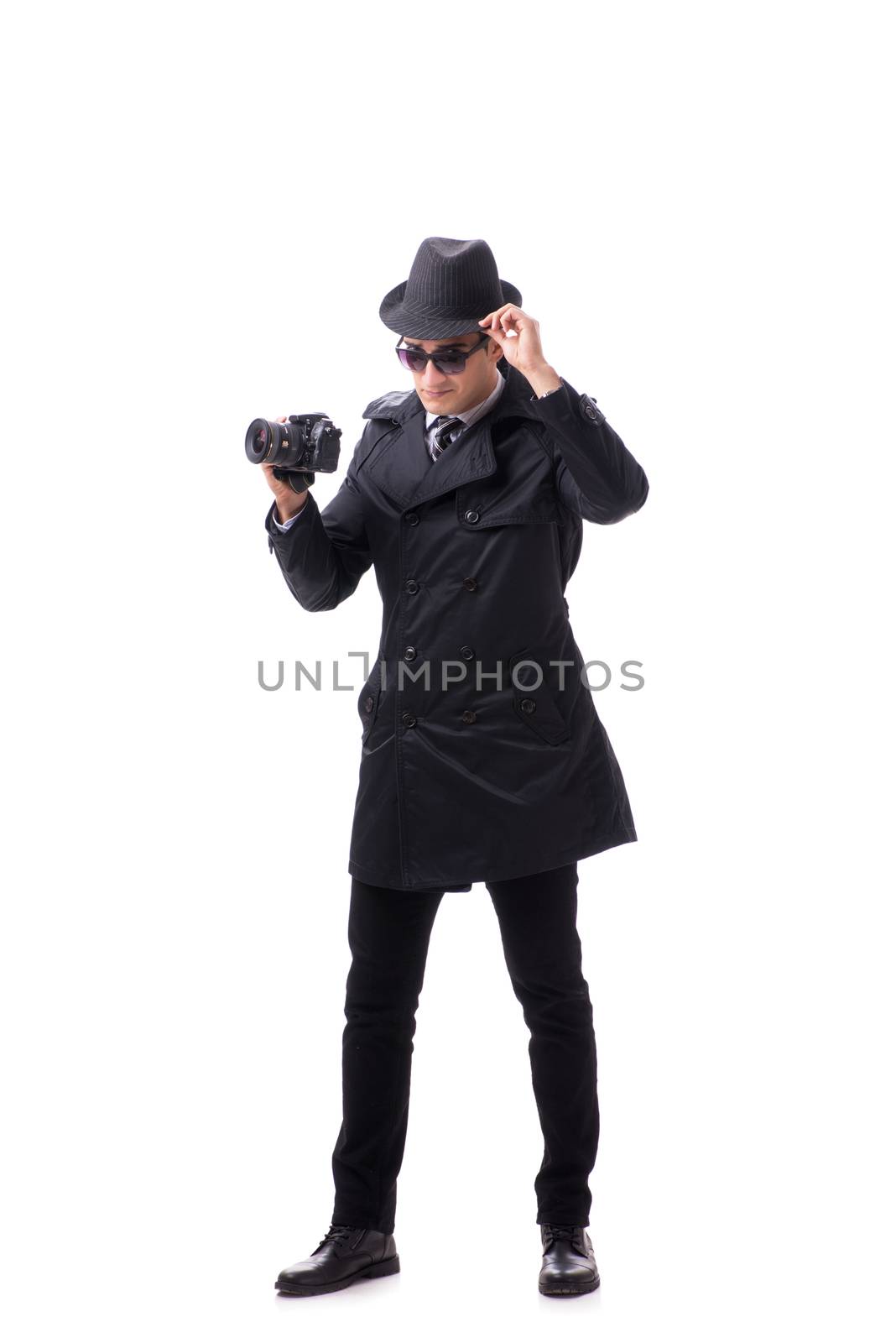 Spy with camera taking pictures isolated on white