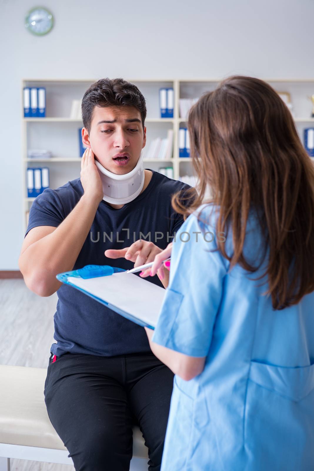 Man with neck injury visiting doctor for check-up