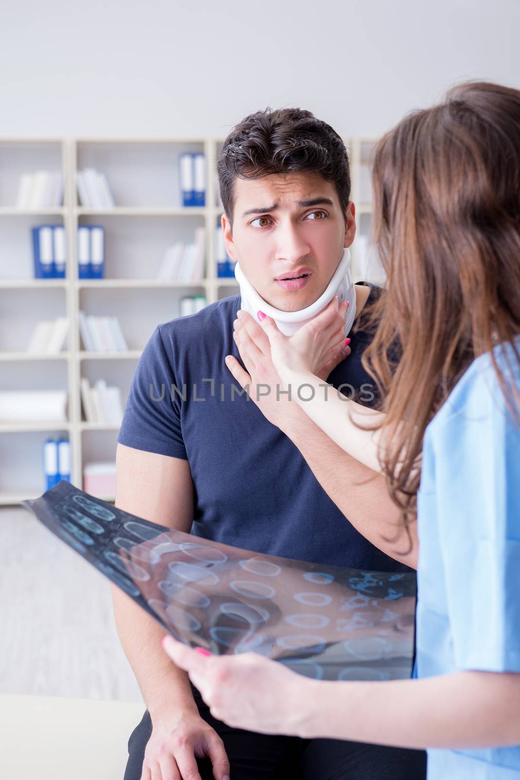 Man with neck injury visiting doctor for check-up