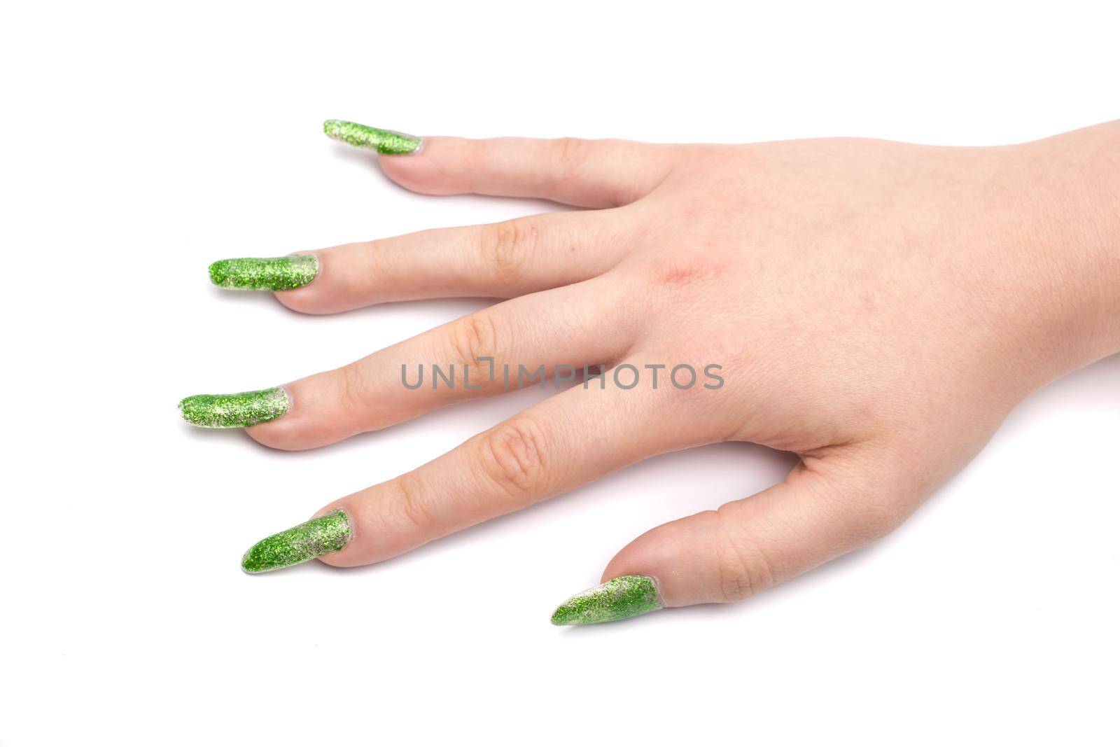 young girls hand with nailart on white