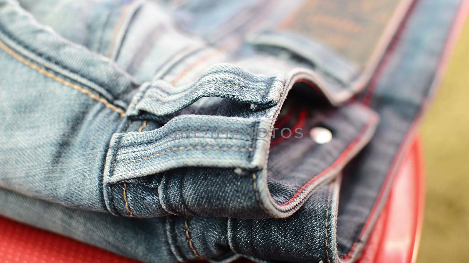 close up detail of blue denim jeans, texture background 
