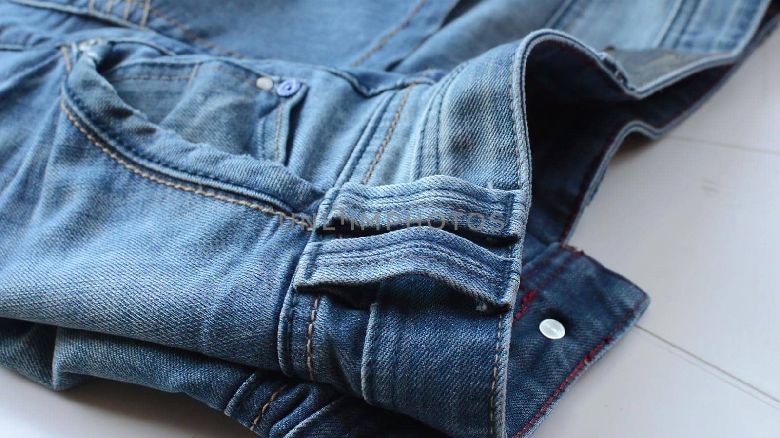 close up detail of blue denim jeans, texture background  by vitanovski