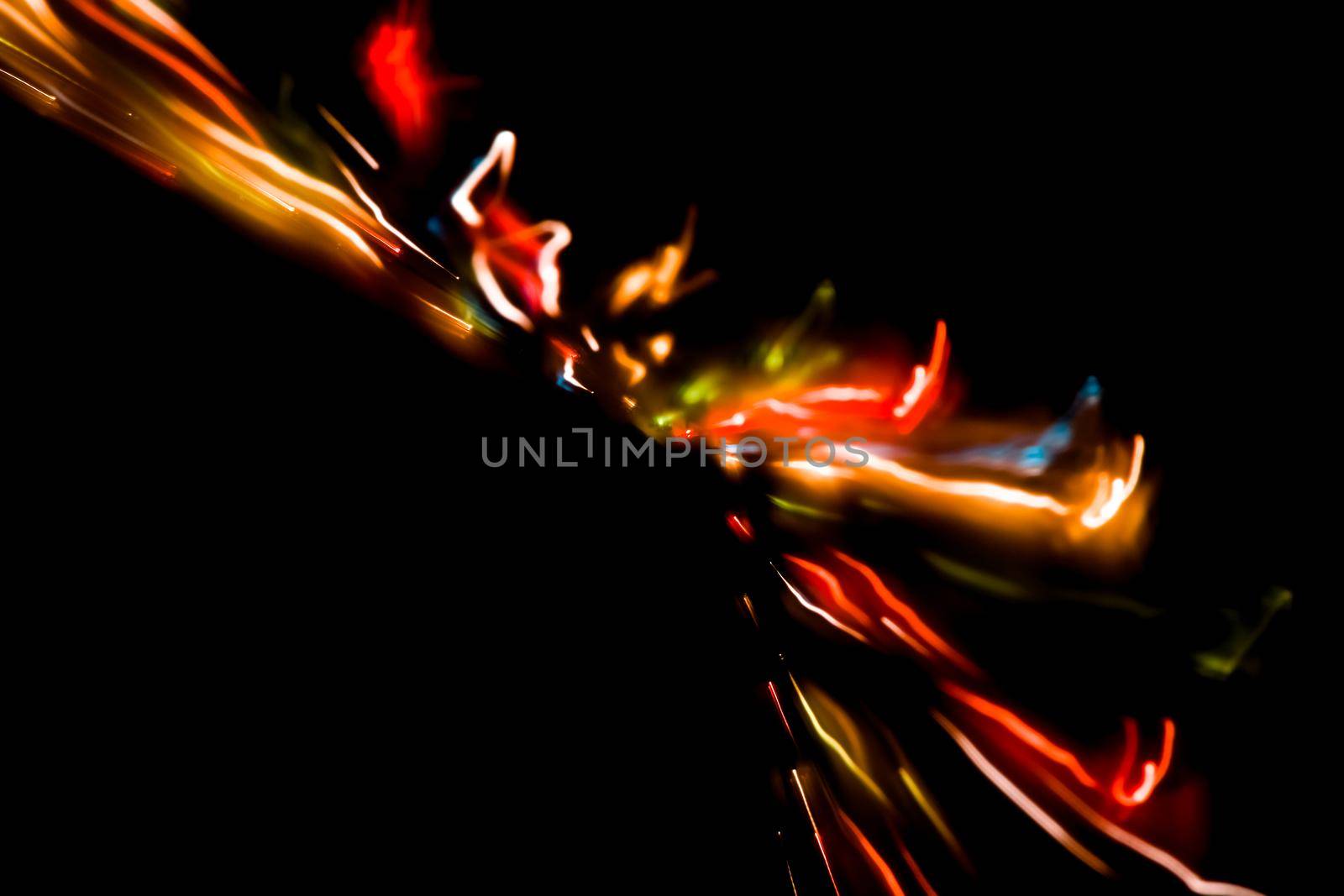 Abstract motion defocused lights on dark background