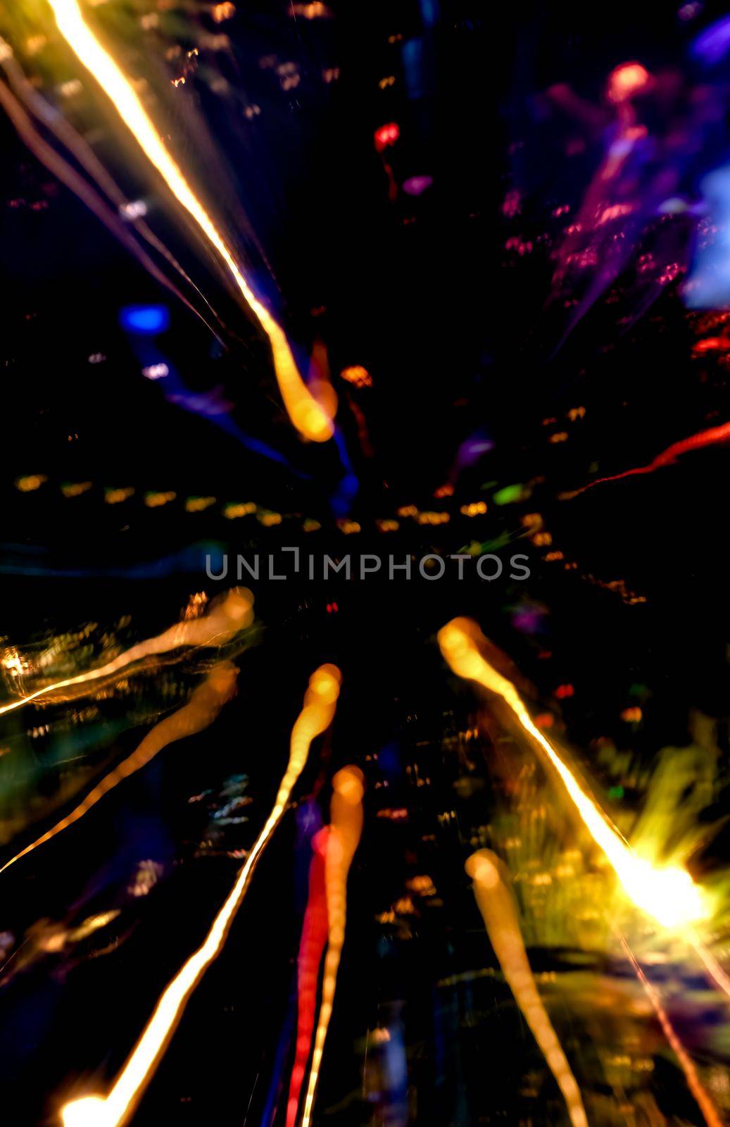 Abstract motion defocused lights on dark background