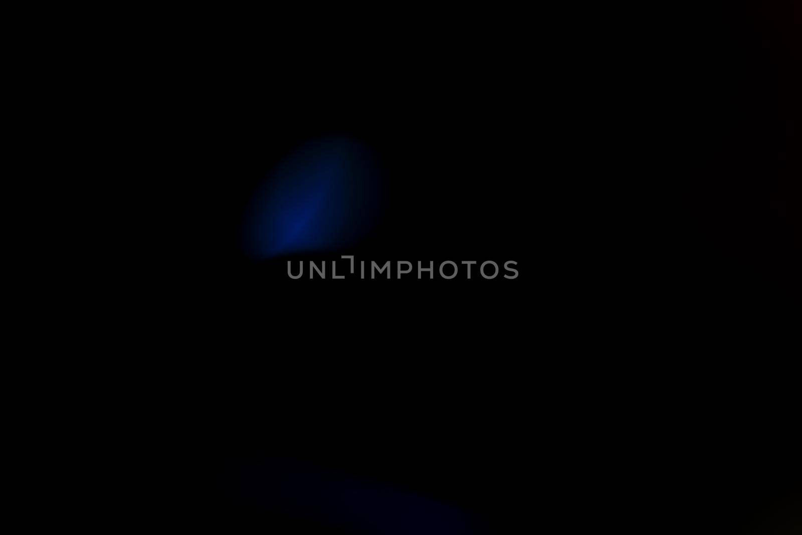 Abstract motion defocused lights on dark background