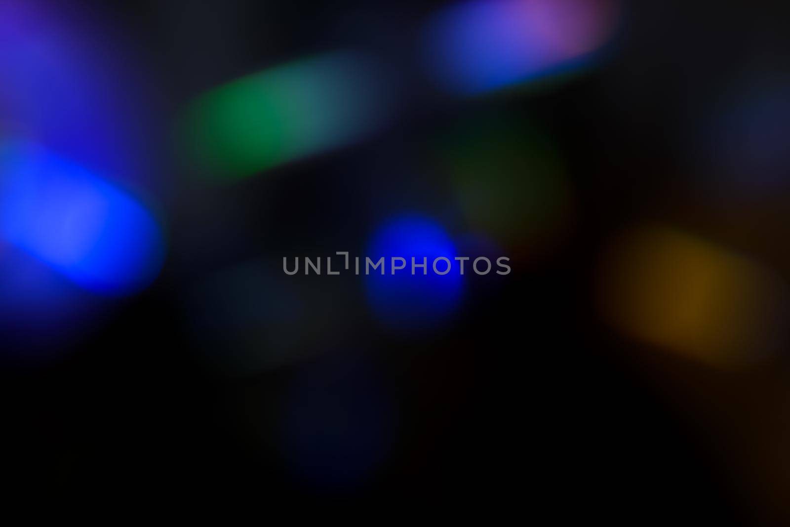 Abstract motion defocused lights on dark background