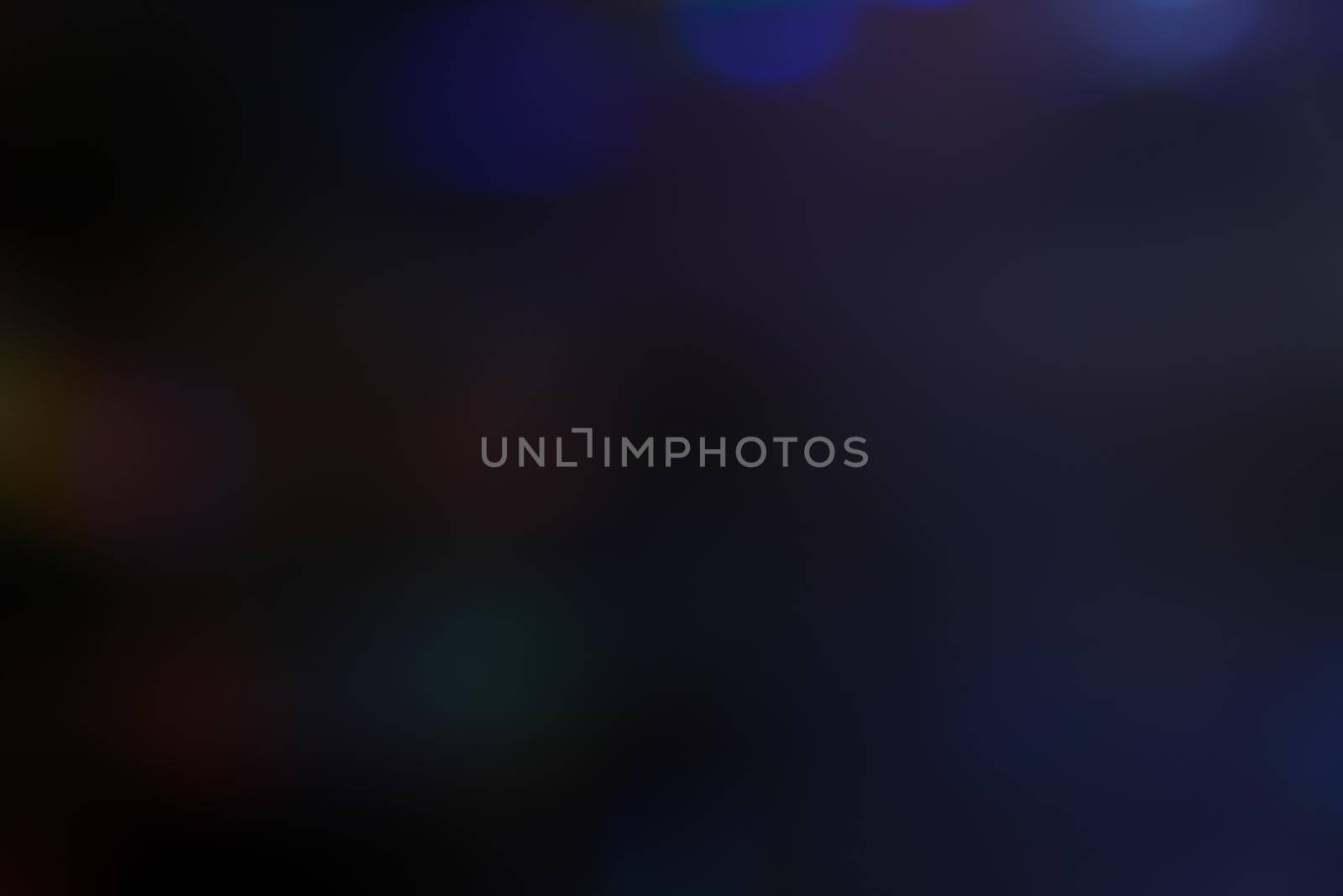 Abstract motion defocused lights on dark background