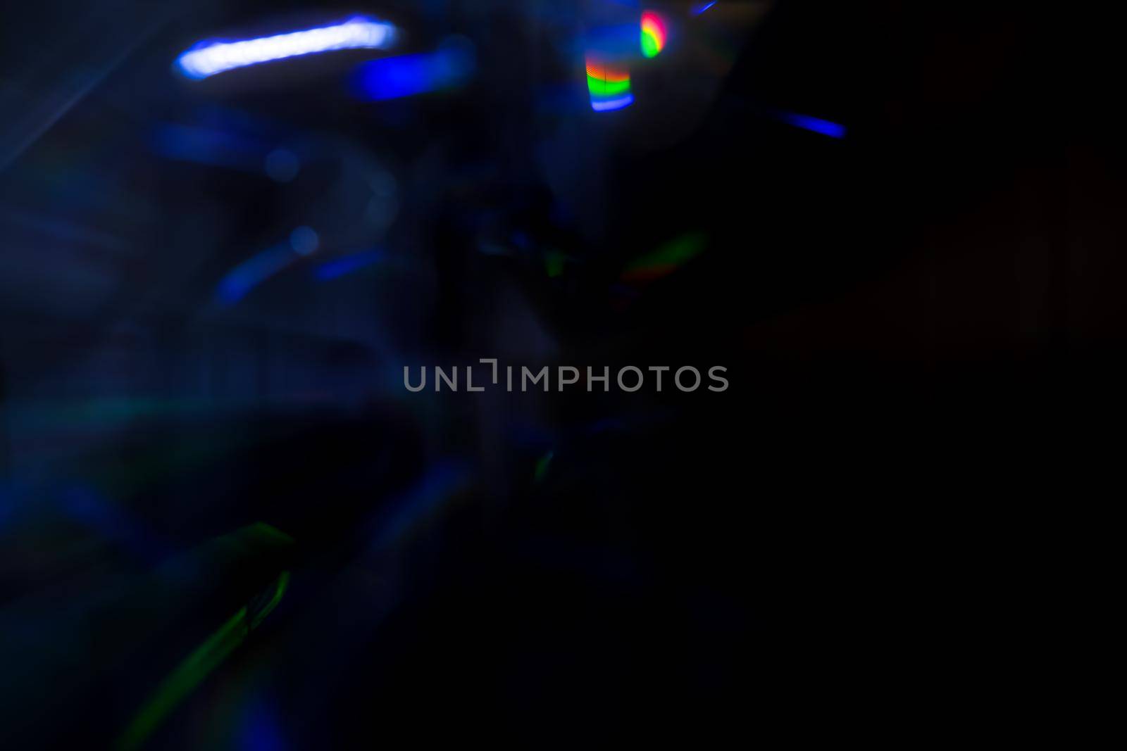 Abstract motion defocused lights on dark background