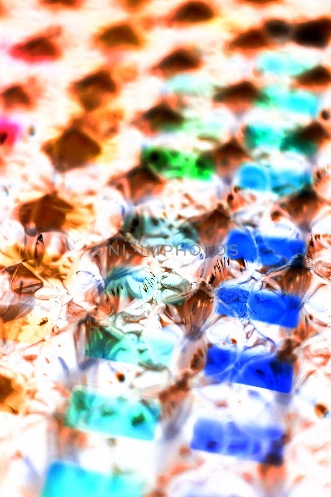 abstract multicolored background created with a colorful image through a sheet of plastic bubble wrap