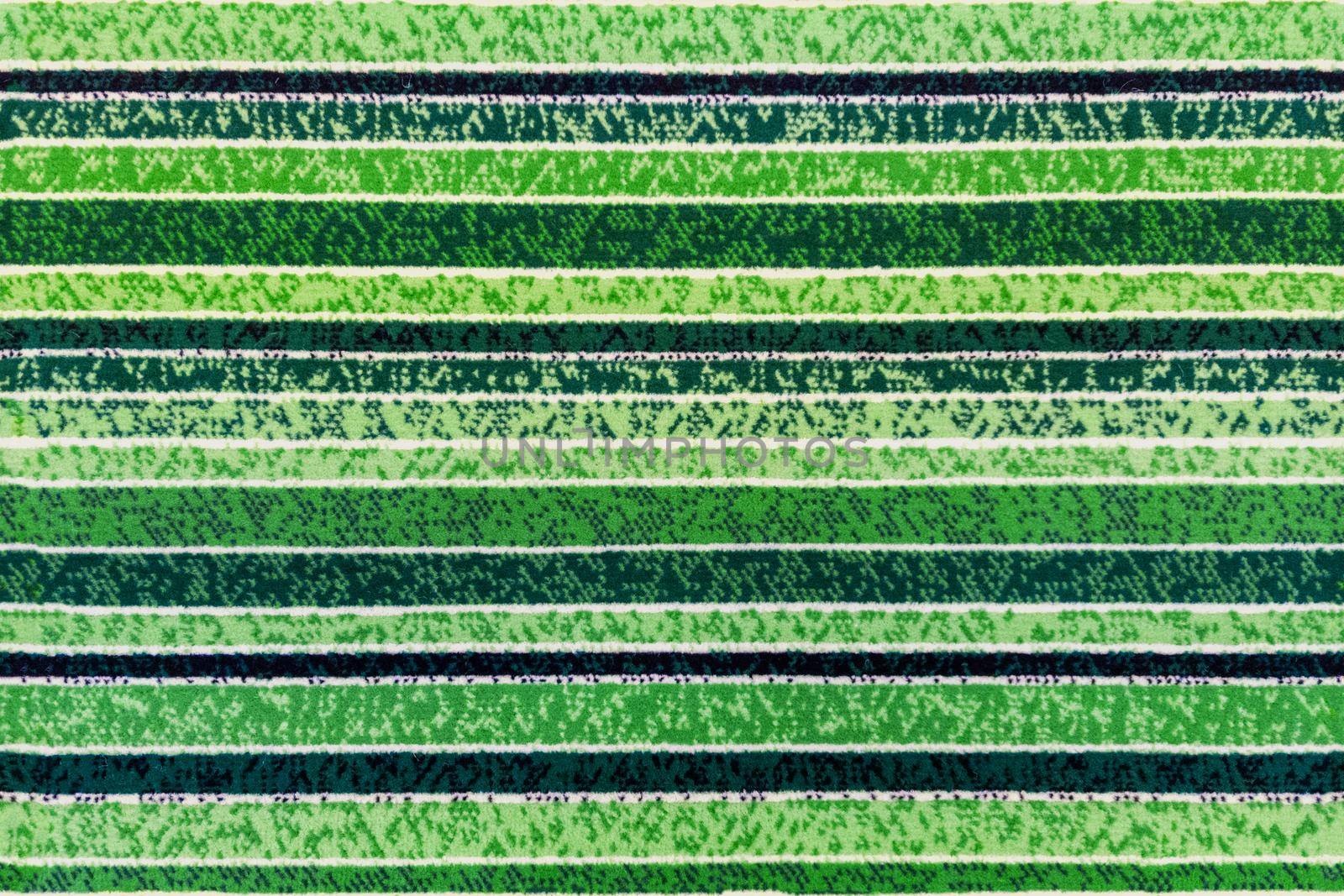 seamless texture of abstract green striped floor synthetic carpet surface