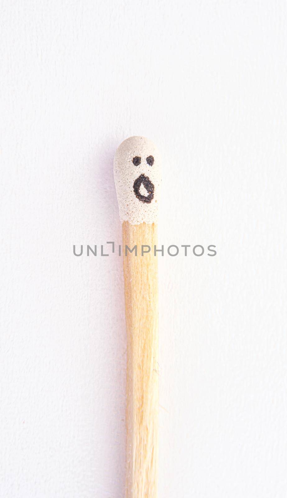matchstick with faces painted on the heads