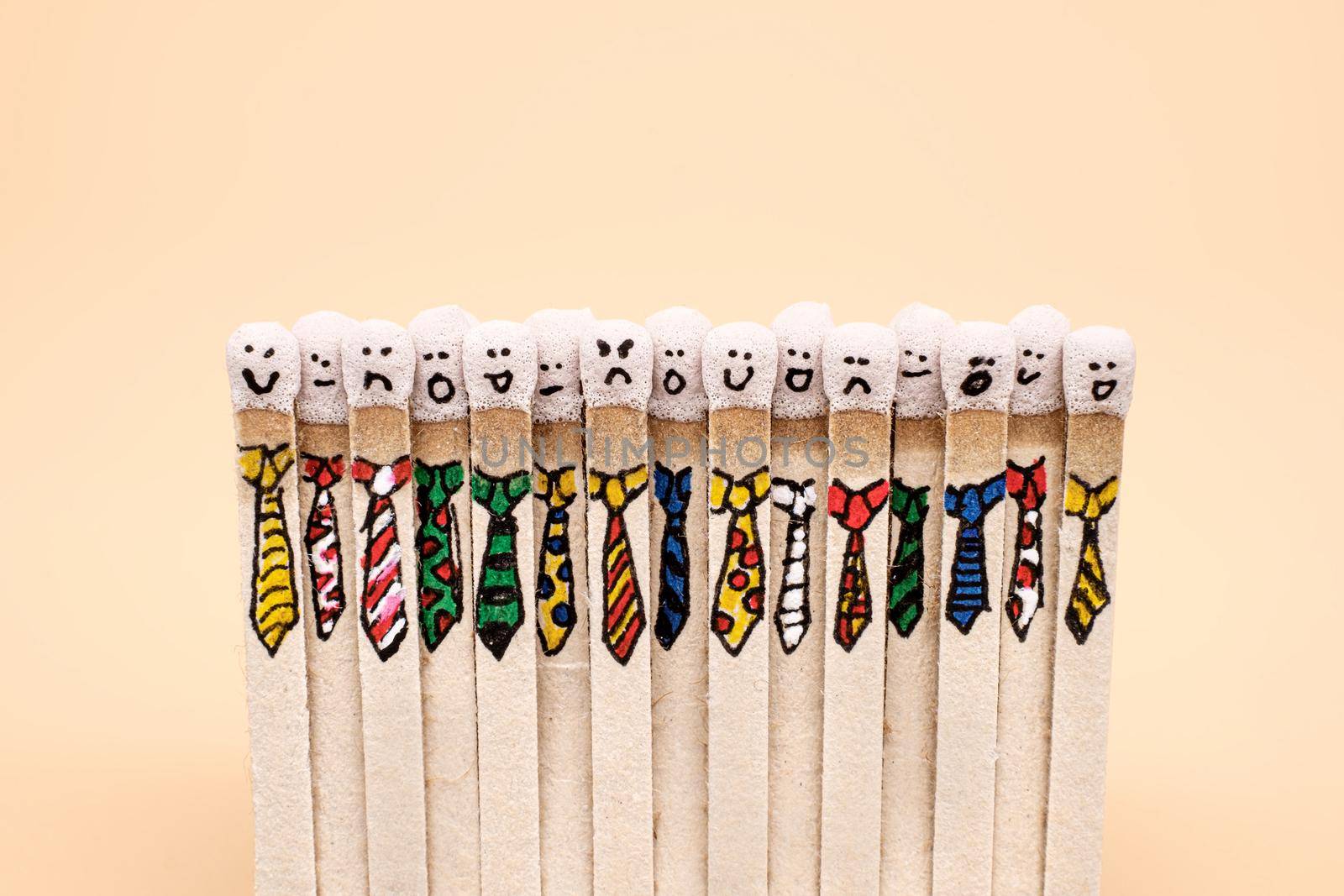 matchsticks with faces painted on the heads by Roberto