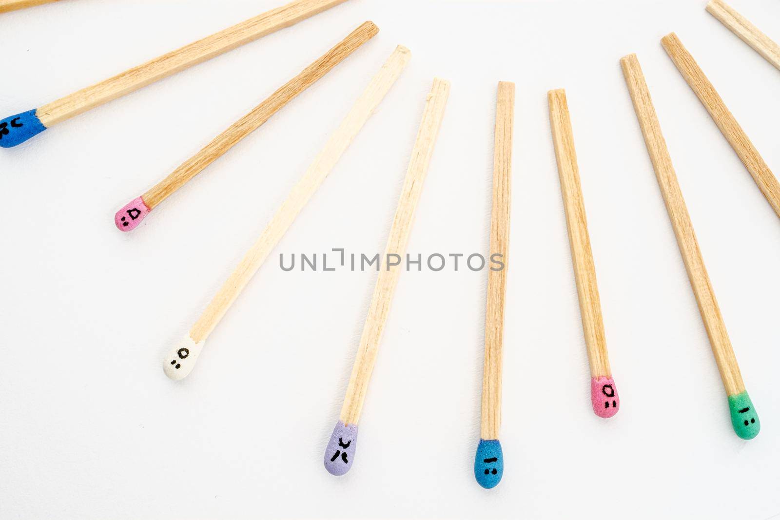 matchsticks with faces painted on the heads by Roberto