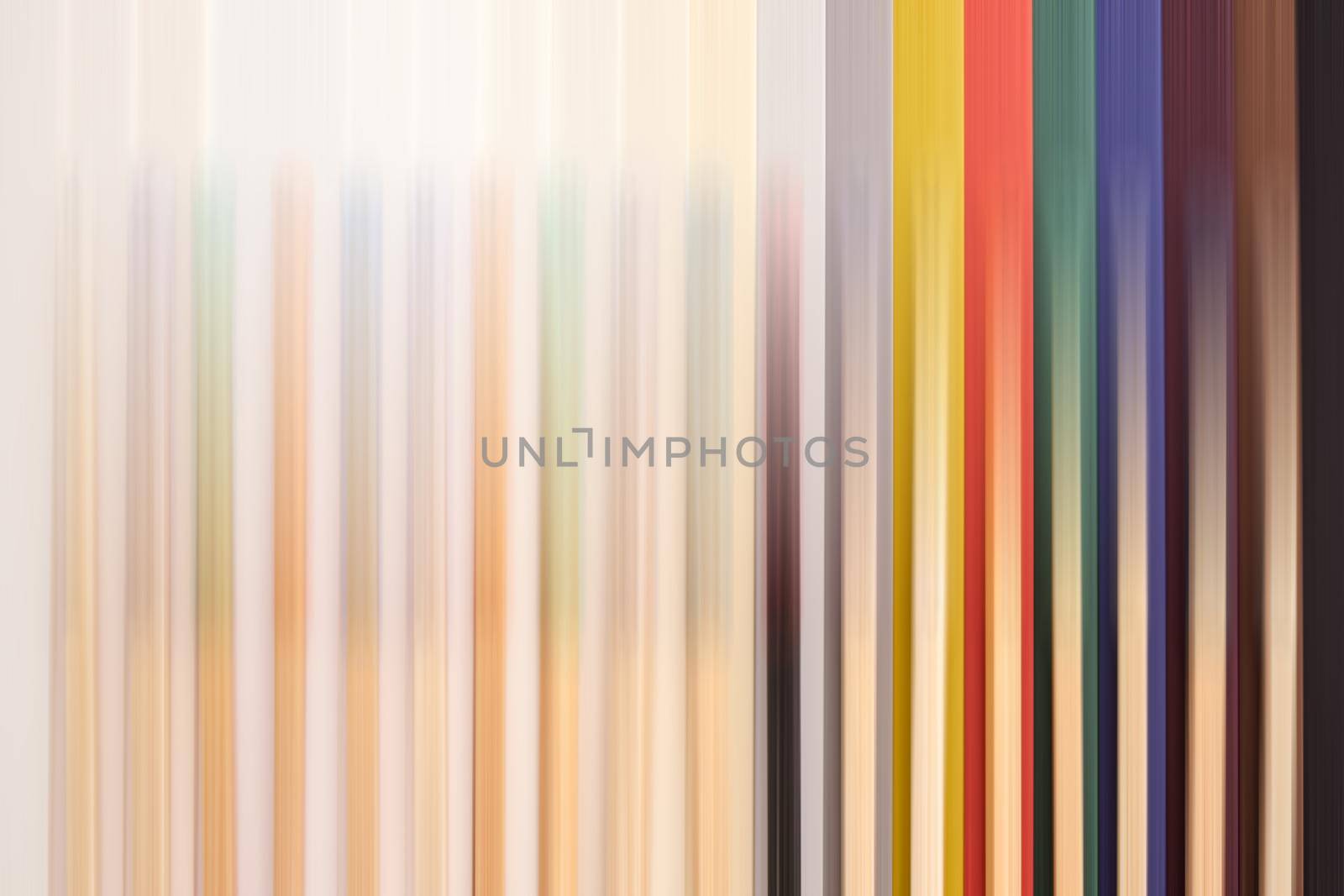 multicolored matchsticks on multicolored paper, motion blur by Roberto