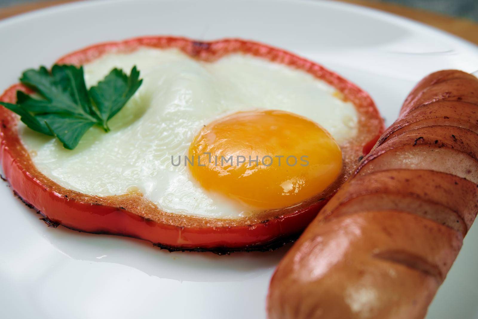 fried egg with red bell pepper on the plate.